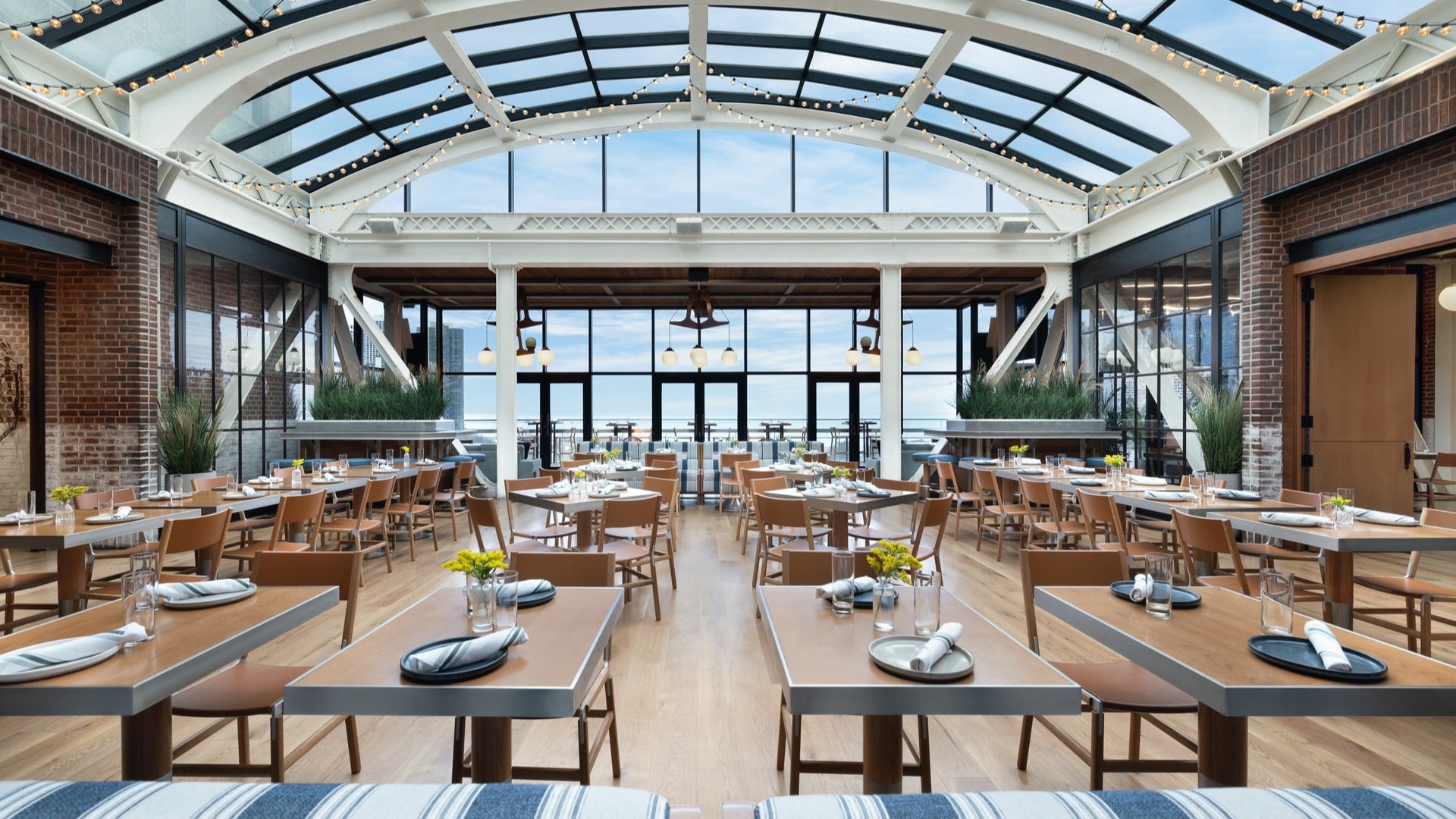 dining space with outdoor area and roof